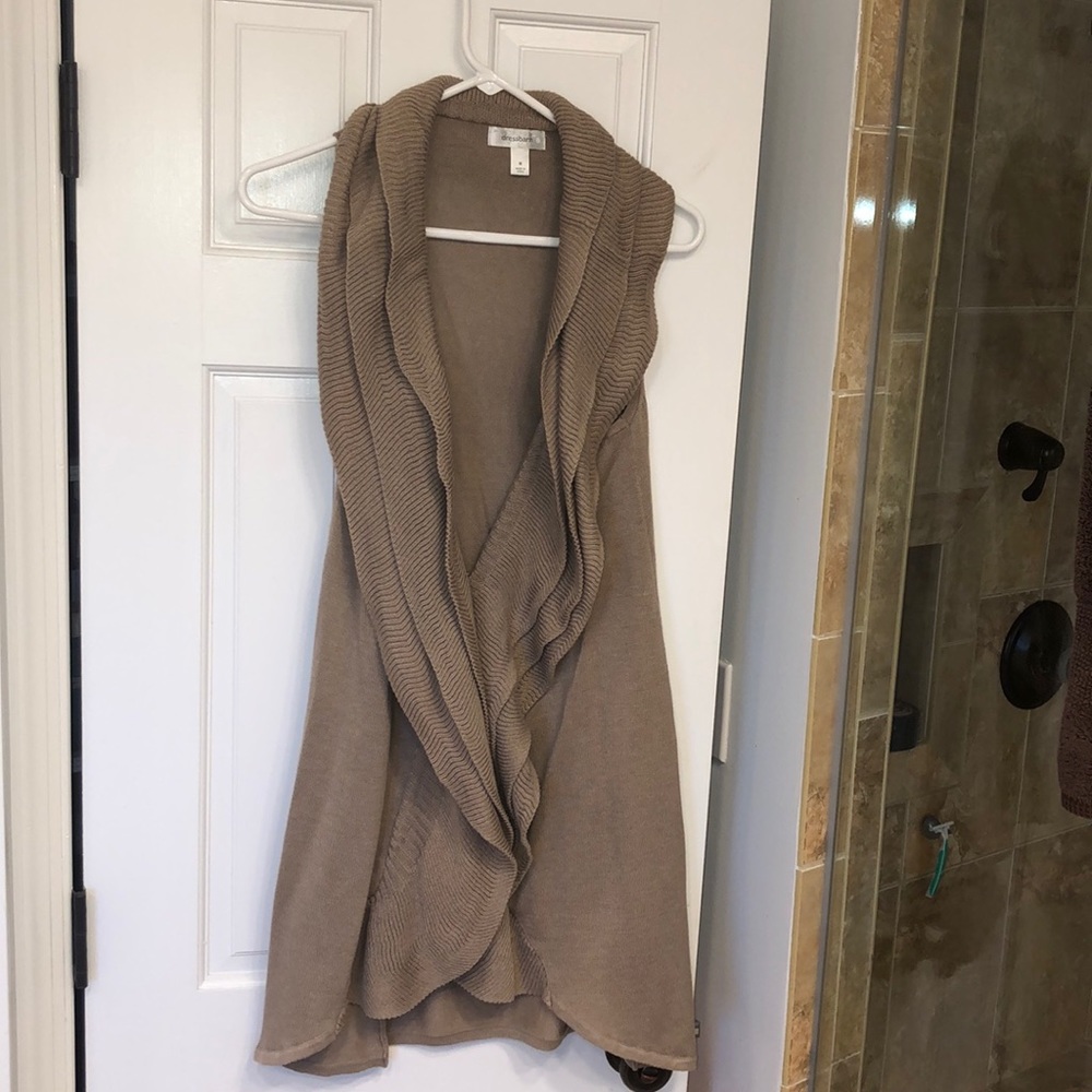 Ruffle trimmed long cardigan vest.